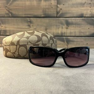 Black coach sunglasses with pink tint and pink rhinestones.
